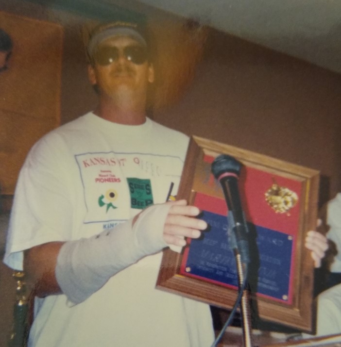 Picture of Marty holding his Jim Quinn Award in 1997